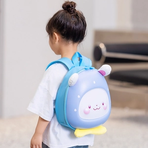 Cute light blue cartoon rabbit hardshell backpack for toddlers shown on a child model