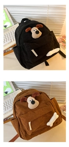Close-up of corduroy children's backpack with plush cartoon dog and bone accessory