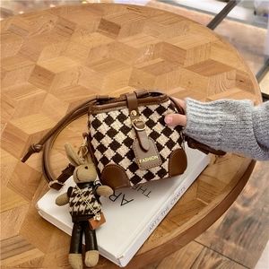 Classic quilted bucket bag for girls with leather trim and cute rabbit pendant charm