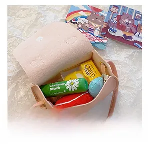Internal capacity of pink mini crossbody bag showing storage for small accessories