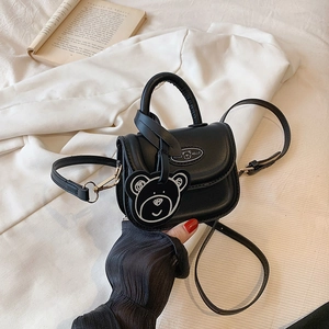 Mini borsa a tracolla nera chic con ciondolo a orsetto e manico rotondo per bambine