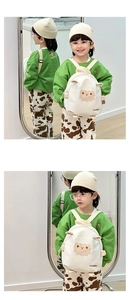 Detailed view of kids' white canvas backpack with a 3D cute cartoon sheep embroidery