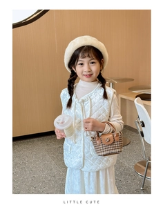 Girl's vintage brown plaid mini handbag styled with a white quilted velvet vest outfit