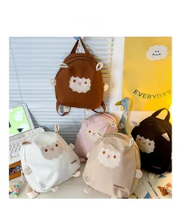 Close-up of cute cartoon lamb canvas backpacks for kids in five assorted colors