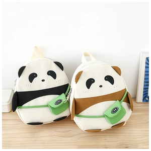 Close-up of cute panda backpacks in black and brown with small green sport accessory bags