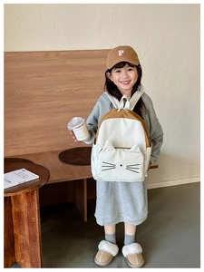 Detail of cartoon cat backpack with cute 3D ears and embroidery for kids school