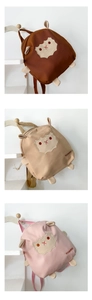 Detailed view of canvas kids backpacks with 3D sheep ears in brown, beige and pink colors