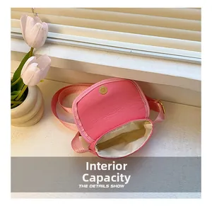 Macro view of the pink mini bag interior with magnetic snap closure and fabric lining