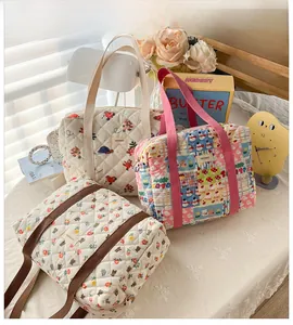 Detailed view of quilted floral and bear pattern girls' crossbody bags with zipper