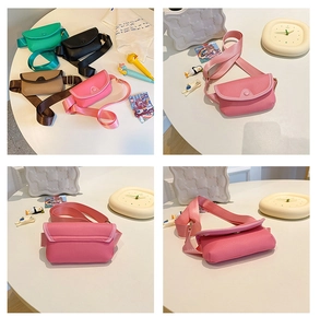 Detail view of mini PU leather girls' crossbody bags with wide nylon straps and metal snaps