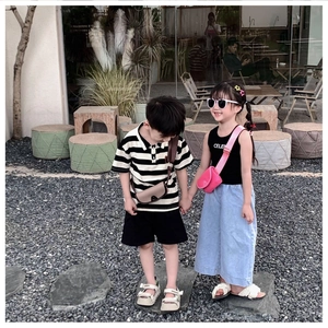 Kids wearing minimalist mini crossbody bags with trendy summer outfits in outdoor setting