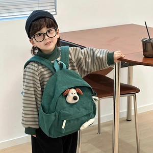 Green corduroy toddler backpack featuring cute 3D cartoon dog character for kids