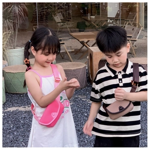 Detail of stylish half-moon mini crossbody bag for kids featuring a wide woven strap