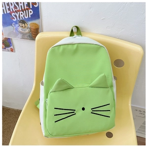 Close-up of cute green cartoon cat backpack with 3D ears and printed whiskers detail