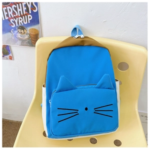 Detail of the cute 3D cat ears and embroidery on the vibrant blue children's backpack