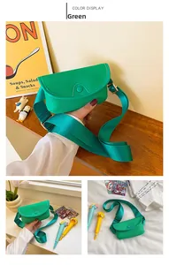 Detail of green litchi grain PU leather mini bag with adjustable nylon wide strap