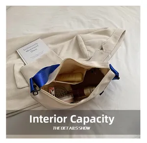 Detailed interior of a beige canvas crossbody bag showing large storage capacity and inner pocket