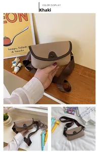 Close-up of khaki pebbled leather mini crossbody bag with wide brown fabric strap