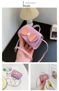 Detailed view of mini purple PU leather crossbody bag with large pink bow for girls