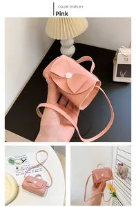 Detailed views of pink mini crossbody bag with bow decoration and pebble leather texture