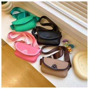 Detailed top view of four colorful mini PU leather semi-circle bags with nylon straps