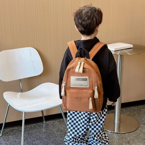 Sac à dos scolaire enfant minimaliste en toile marron avec grand compartiment