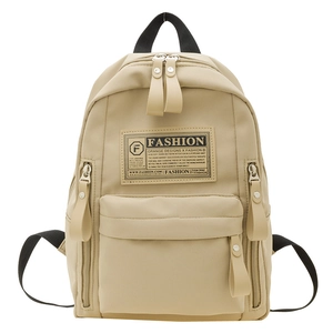 Sac à dos minimaliste en toile beige pour enfants avec poche frontale zippée pratique