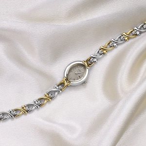 Elegant GEDI women's quartz watch with oval dial and gold-silver link bracelet on satin