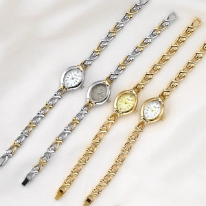 Elegant GEDI women's quartz watch with vintage X-shaped metal chain bracelet and oval dial