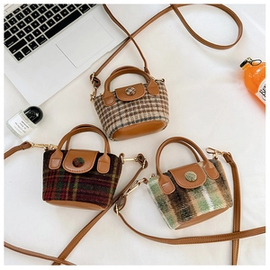 Flat lay of vintage plaid mini crossbody bags in khaki, brown, and green wool fabric