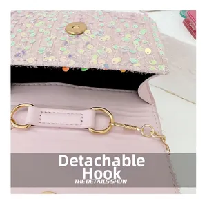 Close-up of detachable gold metal buckle and pink sequin surface on kids mini bag