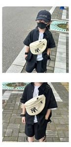 Close-up of canvas kids waist bag with NY embroidery and adjustable black nylon strap