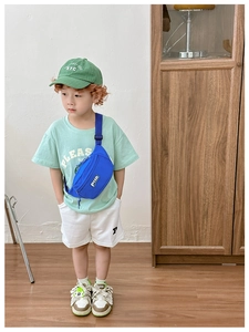 Detail of blue nylon kids waist bag with adjustable strap and logo on modern background