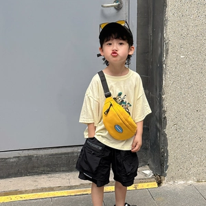 Vibrant yellow canvas crossbody bag for kids with adjustable black strap and brand patch
