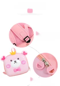 Detail view of pink bear backpack featuring breathable mesh straps and round zipper pulls
