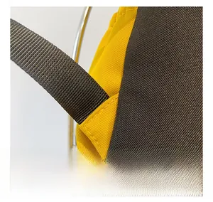 Macro detail of reinforced stitching on yellow and grey canvas kids drawstring backpack