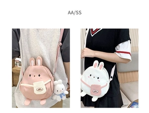 Detail of cute rabbit canvas crossbody bags with 3D ears and plush bunny pendant