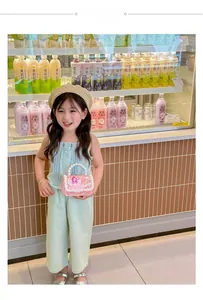 Young girl styling a pink sequin mini bag with pearl handle in a bright grocery aisle