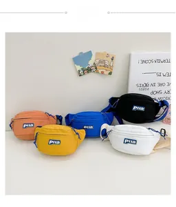 Detail view of colorful nylon chest bags for kids showing Pila logo and zipper texture