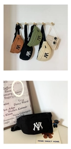 Detail view of canvas waist bags in four colors with NY embroidery and adjustable straps