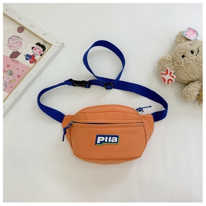 Detail of orange canvas waist bag for kids with adjustable blue strap and brand label