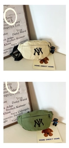 Detail view of beige and olive green canvas waist bags with NY embroidery and adjustable strap