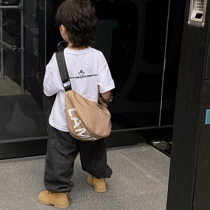 Minimalist khaki canvas moon-shaped bag for kids featuring white LAMP print and black strap