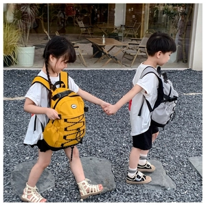 Kids lightweight drawstring canvas backpack with side pockets and durable handle detail
