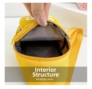 Detail of the bright yellow shoulder bag showing its spacious inner compartment and lining