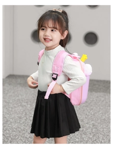 Close-up of pink cartoon bear backpack with yellow crown for kindergarten girls