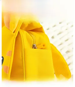 Close-up of smooth zipper detail and durable side pocket on yellow kids backpack