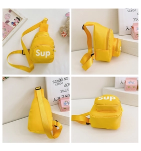 Detailed views of yellow nylon kids chest bag featuring Sup letter print and adjustable strap