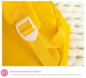 Close-up of adjustable white plastic shoulder strap buckle on yellow toddler backpack