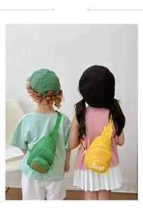 Kids fashion canvas crossbody bags in green and yellow with adjustable straps and Sup logo